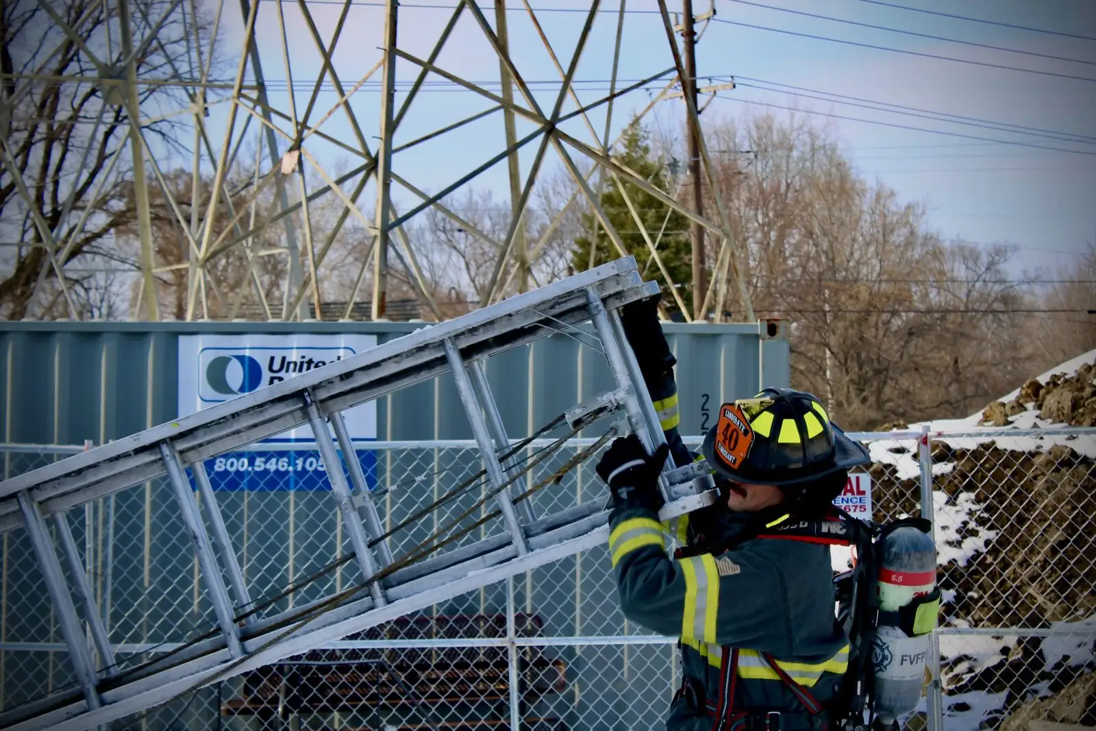 A candidate firefighter climbs during ladder training