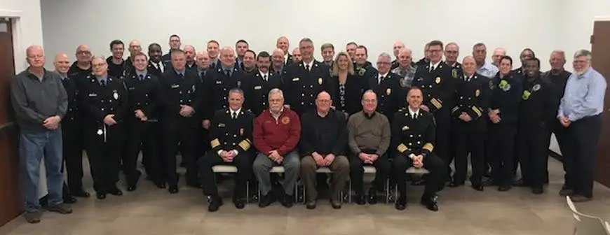 Members of the District gathered together inside the firehouse