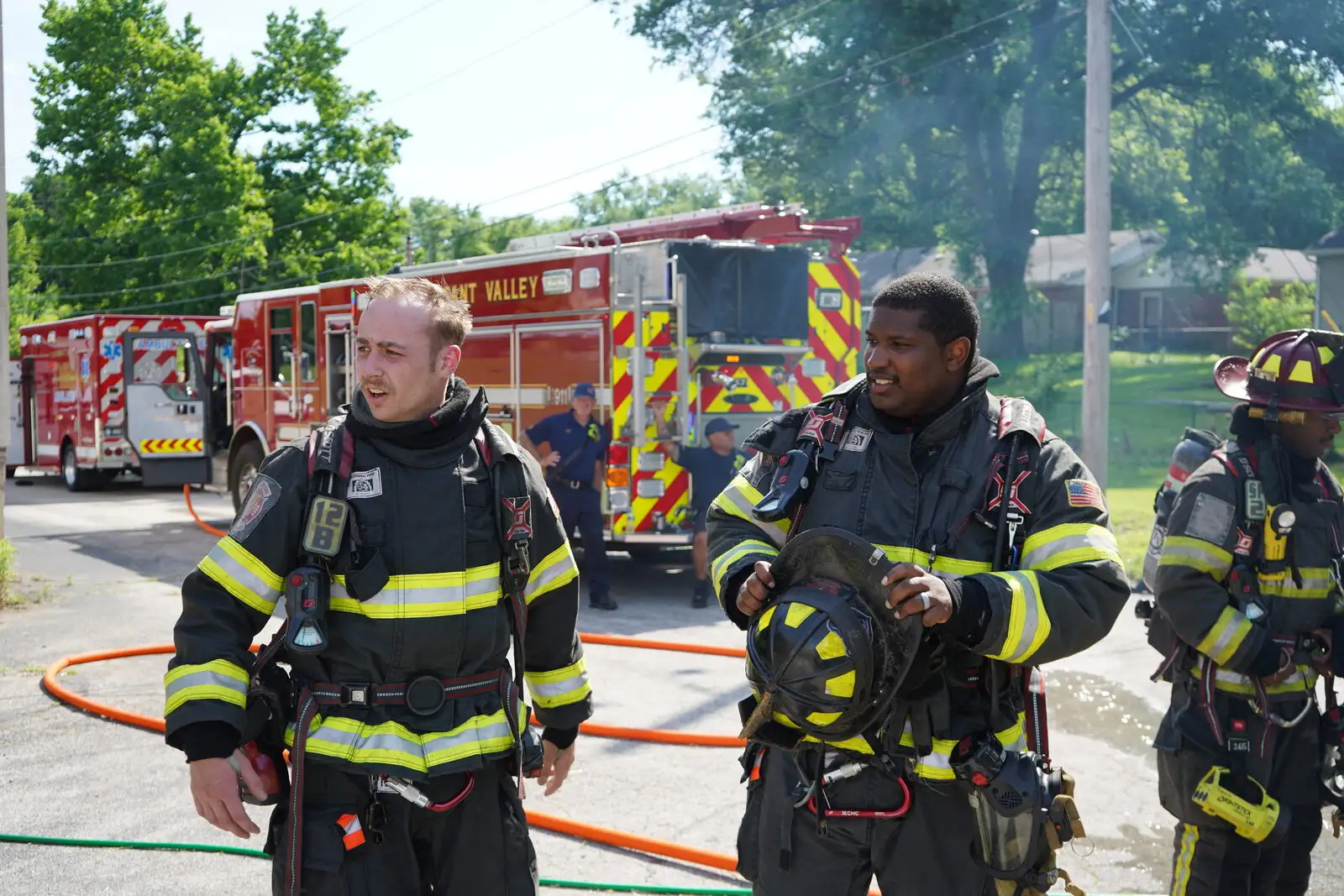 Firefighter/paramedics in full turnout gear on scene