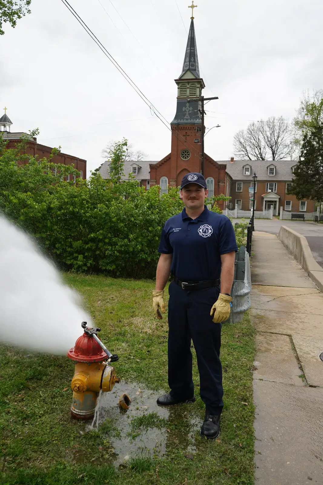A fire inspector runs a hydrant flow test