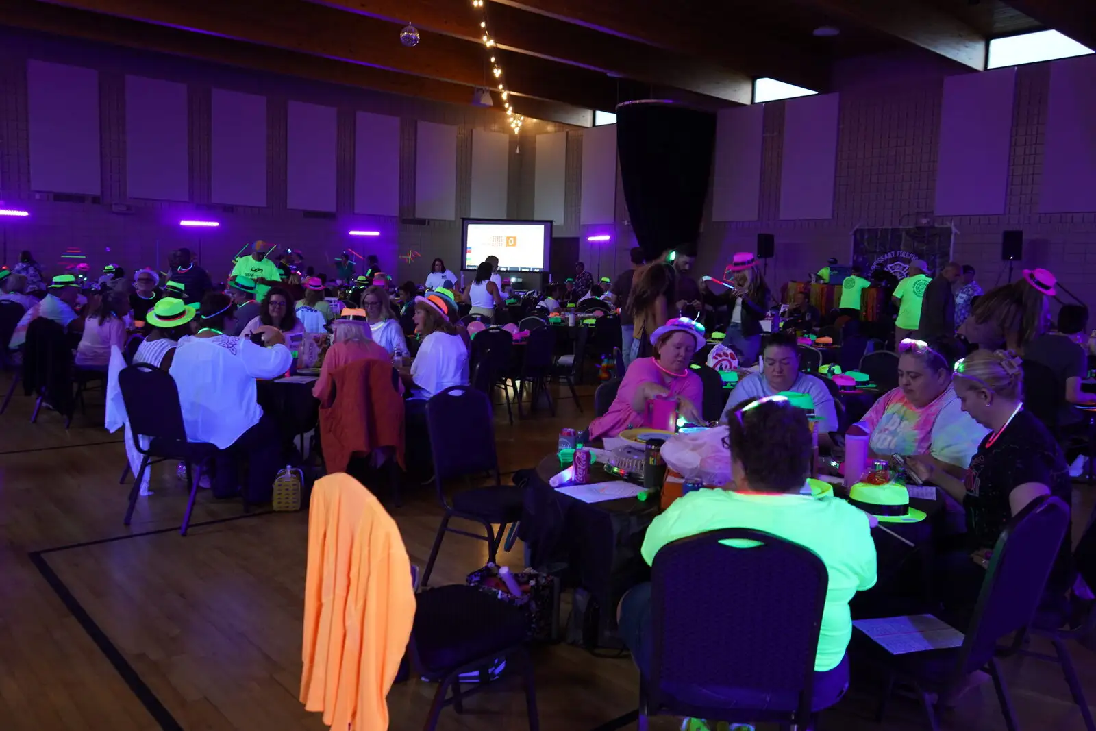 A packed room at the Black Light Bingo Bash fundraiser