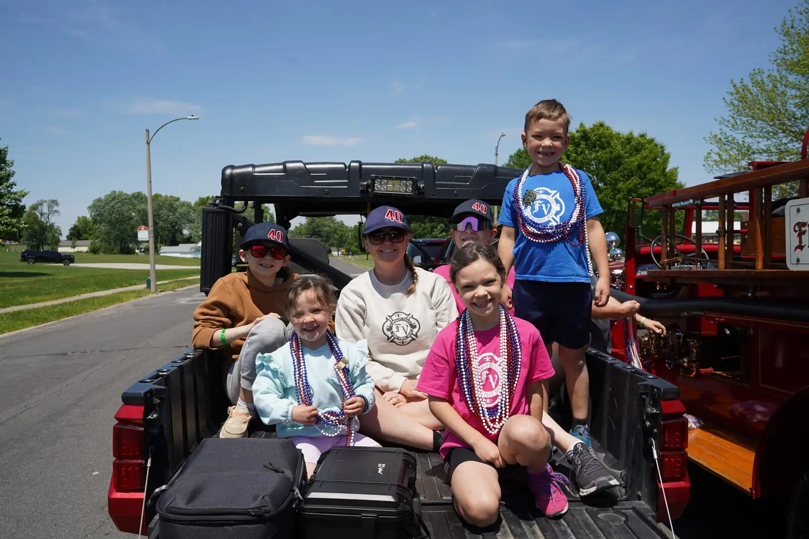 Families riding on a District fire apparatus at a community event