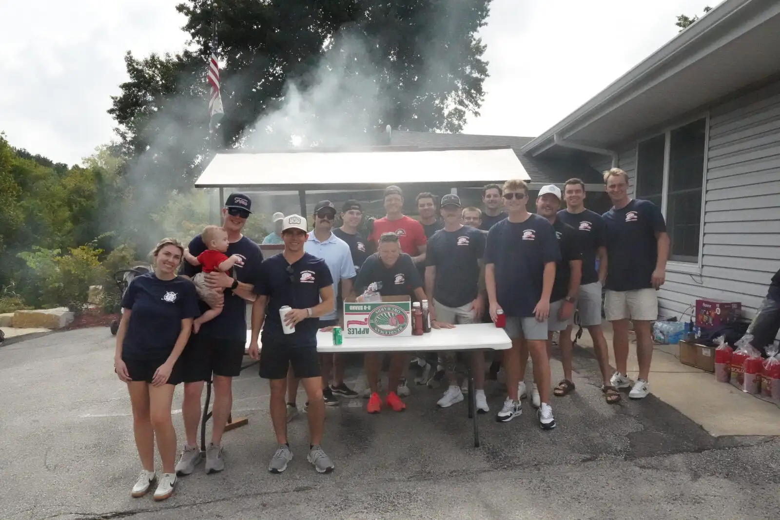 The community outreach team at a cookout fundraiser